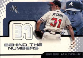 2001 Fleer E-X - Behind the Numbers Game Jersey #NNO Greg Maddux Front