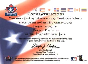 2002 Fleer Premium - International Pride Game Used #NNO Carlos Delgado Back