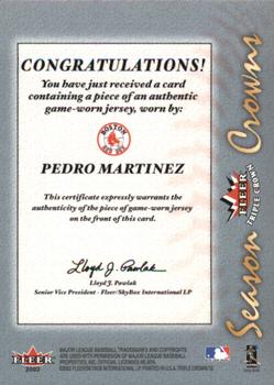 2002 Fleer Triple Crown - Season Crowns Game-Used #NNO Randy Johnson / Pedro Martinez / Greg Maddux Back