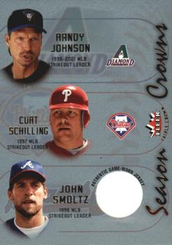 2002 Fleer Triple Crown - Season Crowns Game-Used #NNO Randy Johnson / Curt Schilling / John Smoltz Front