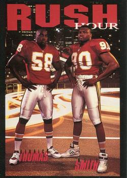 1993 SkyBox Premium - Costacos Brothers #CB9 Derrick Thomas / Neil Smith Front