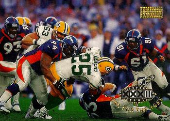 1998 SkyBox Premium #199 Keith Traylor tackles Levens, foiling another Pack chance Front