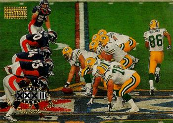 1998 SkyBox Premium #200 Pack offense and Bronco defense line up at midfield Front
