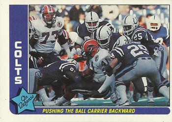 1985 Fleer Team Action #32 Pushing the Ball Carrier Backward Front