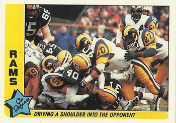 1985 Fleer Team Action #41 Driving a Shoulder into the Opponent Front