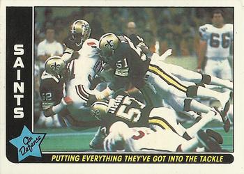 1985 Fleer Team Action #53 Putting Everything They've Got into the Tackle Front