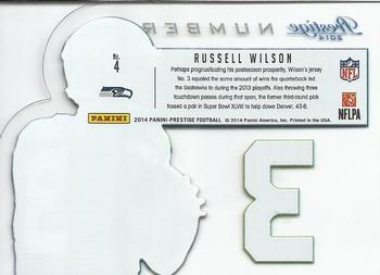2014 Panini Prestige - Behind The Jersey Numbers #4 Russell Wilson Back