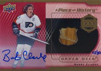 2018-19 Upper Deck - A Piece of History 1,000 Point Club Auto Relic #PC-BC Bobby Clarke Front