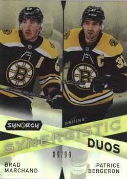 2022-23 Upper Deck Synergy - Synergistic Duos Star-Star Gold #SD-13 Brad Marchand / Patrice Bergeron Front