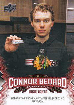 2023-24 Upper Deck Connor Bedard Collection #21 Bedard takes home a gift after he scores his first goal Front