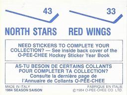 1984-85 O-Pee-Chee Stickers #33 / 43 Red Wings Logo / North Stars Logo Back