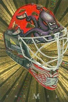 2001-02 Be a Player Between the Pipes - The Mask Gold #NNO Manny Legace Front
