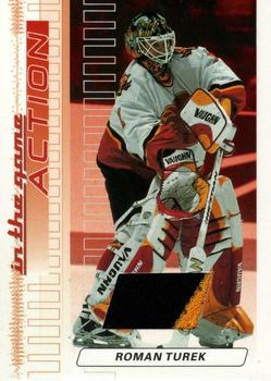 2003-04 In The Game Action - Jerseys #M-85 Roman Turek Front
