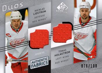 2008-09 SP Game Used - Authentic Fabrics Duos #AF2-LH Nicklas Lidstrom / Tomas Holmstrom  Front