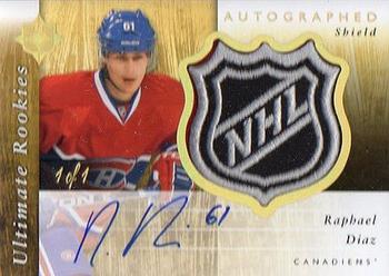 2011-12 Upper Deck Ultimate Collection - Rookie NHL Shield Autographs #117 Raphael Diaz Front
