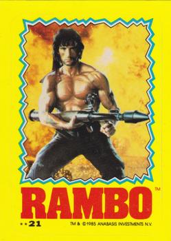 1985 Topps Rambo First Blood Part II - Stickers #21 Rambo w/bazooka/flaming background Front