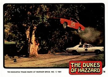 1981 Donruss The Dukes of Hazzard #2 General Lee Jumping Police Car Front