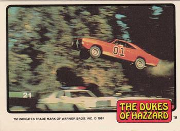1981 Donruss The Dukes of Hazzard #21 General Lee Flying Over Police Car Front