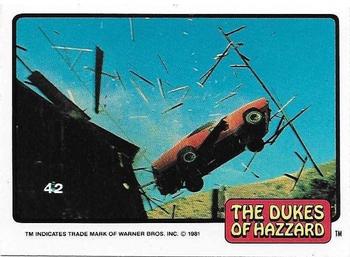 1981 Donruss The Dukes of Hazzard #42 General Lee Jumping Through Building Front