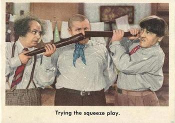 1959 Fleer The Three Stooges #96 Trying the squeeze play. Front