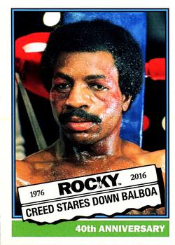2016 Topps Rocky 40th Anniversary National Promo #7 Creed Stares Down Balboa Front