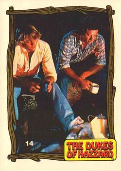 1983 Donruss The Dukes of Hazzard #14 Bo and Luke by the campfire Front