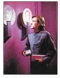 1987 Panini Star Trek: The Next Generation Stickers #114 Wyatt looking at sketches of himself on Tarellian ship Front