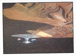 1987 Panini Star Trek: The Next Generation Stickers #152 Enterprise and Ferengi ship held motionless in space Front