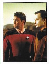 1987 Panini Star Trek: The Next Generation Stickers #220 Riker standing next to Q, who looks like Data Front