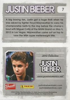 2012 Panini Justin Bieber #7 A big boxing fan, Justin got a huge thrill when he was asked by fighter Floyd Mayweather to carry his championship belts to the ring... Back