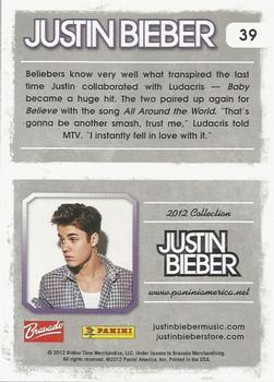 2012 Panini Justin Bieber #39 Beliebers know very well what transpired the last time Justin collaborated with Ludacris... Back
