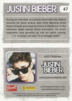 2012 Panini Justin Bieber #47 During an interview and photo shoot with GQ, Bieber showed his more mature side while donning some flashy threads... Back