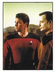 1992 Panini Star Trek: The Next Generation Stickers (Red backs) #220 Riker standing next to Q, who looks like Data Front