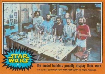 1977 Topps Star Wars #311 The model builders proudly display their work Front