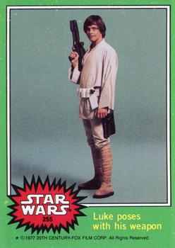 1977 Topps Star Wars #255 Luke poses with his weapon Front