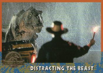 1993 Topps Jurassic Park Gold #41 Distracting the Beast Front