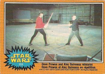 1977 O-Pee-Chee Star Wars #253 Dave Prowse and Alec Guinness rehearse Front