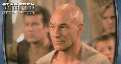 1998 SkyBox Star Trek Insurrection #16 Picard is beamed up with a group ... Front