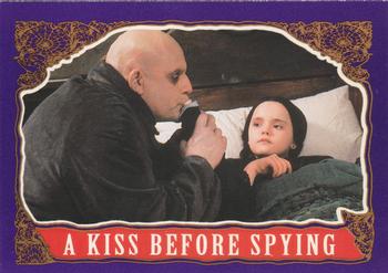 1991 Topps The Addams Family #65 A Kiss Before Spying Front