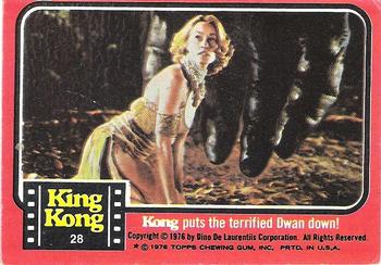 1976 Topps King Kong #28 Kong puts the terrified Dwan down! Front
