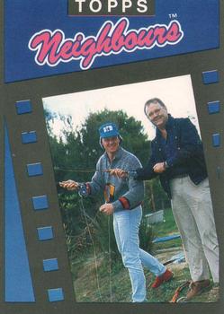 1988 Topps Neighbours Series 1 #3 A tall fishing story in the making. Front
