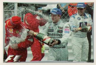 2003 Edizione Figurine Formula 1 #50 Kimi Raikkonen / Michael Schumacher / Juan Pablo Montoya Front