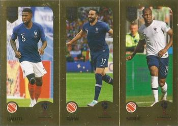 2019 Panini FIFA 365 (Blue Back) #406 Samuel Umtiti / Adil Rami / Djibril Sidibe Front