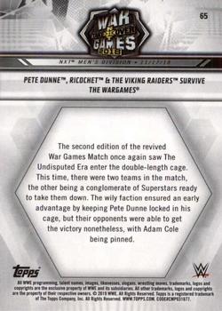 2019 Topps WWE NXT #65 Pete Dunne, Ricochet & The Viking Raiders Survive The WarGames Back