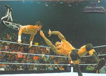 2011 Topps WWE Champions #48 Randy Orton's RKO on Evan Bourne Front